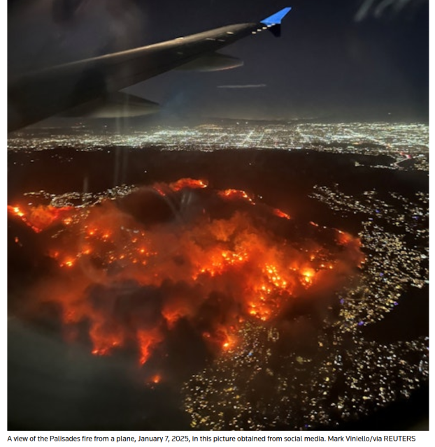 A view of the Palisades fire from a plane, Jan 7 2025, in this picture obtained from Social Media, Mark Viniello via Reuters