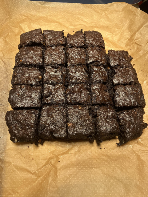 A tray of brownies, with a corner conspicuously missing