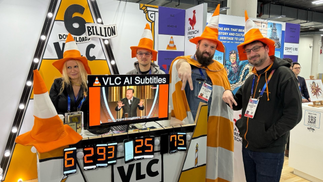 The VLC team wearing cone hats at CES.