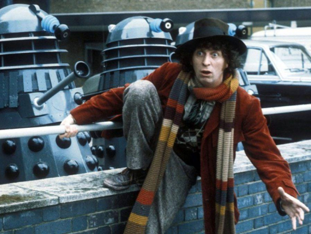 Tom Baker as the 4th Doctor surrounded by Daleks 