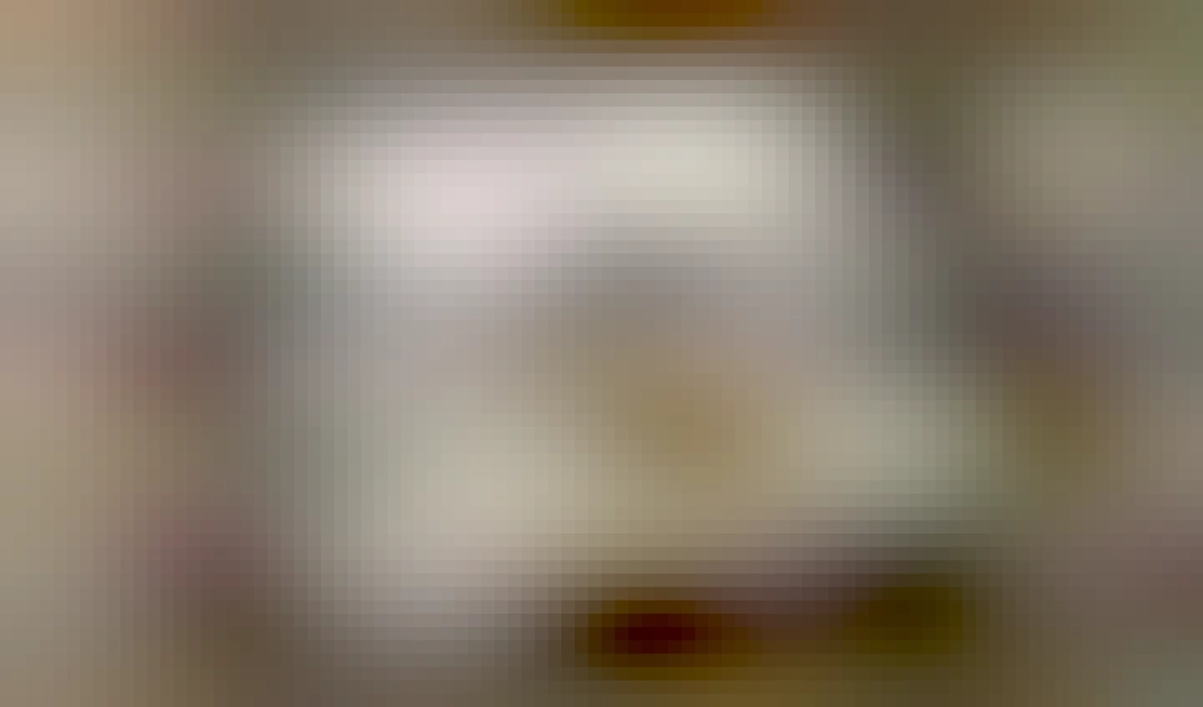 A picture of a 3.5" compact cassette, with its two spools, window for indicating remaining tape, and protective media slide. This one is labeled Macintosh System 7.5 Install Cassette #5.