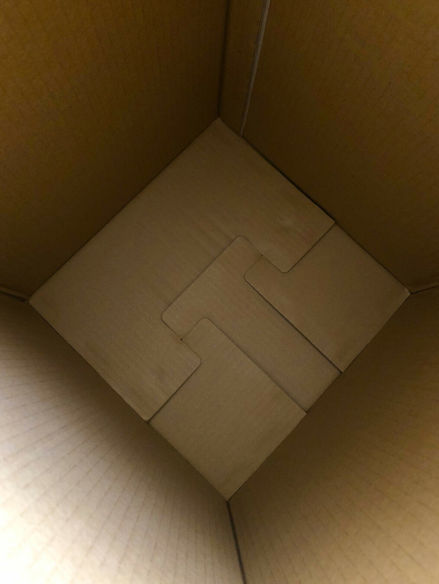 Looking down into a square cardboard box.