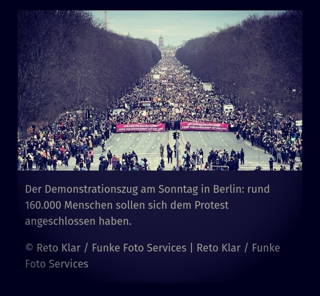 A massive protest march fills the Straße des 17. Juni in Berlin, Germany, with an estimated 160,000 demonstrators. The crowd stretches far into the distance, flanked by leafless trees, leading towards the Brandenburg Gate and Berlin’s cityscape in the background. Large banners at the front of the march read: "KEINE ZUSAMMENARBEIT MIT DER AfD" (No Cooperation with the AfD), indicating a protest against the far-right party. The atmosphere is energetic as people of various backgrounds participate in the demonstration. Photograph by Reto Klar / Funke Foto Services.
