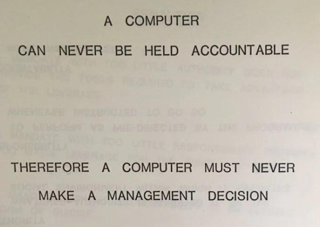 Paper with all caps writing:

A computer can never be held accountable

Therefore a computer must never make a management decision