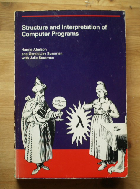 A purple and red book cover, illustrated with a black-and-white line drawing of a disguised cat girl and a heavily disguised cat girl together conjuring a magic lambda.

The book is apparently by a cat girl and two dudes, but possibly the dudes are also cat girls reincarnated as dudes.

It is entitled "Structure and Interpretation of Computer Programs", but this is not what it's called.

Whoever said you can't have also shit-post with alt text?