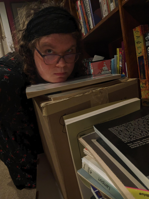 Christine hugging a box of MIT AI memos which are not, as far as she knows, available anywhere but in her house