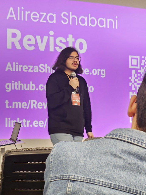 Me presenting at Tehlug (my background is my social media links and my nickname)