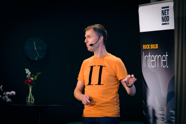 Daniel at a speaking gig, engaged in a presentation