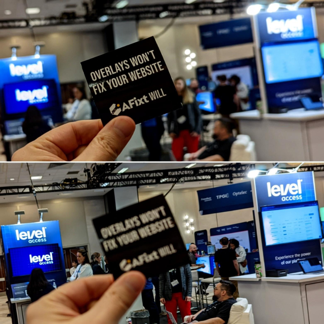 My hand holding up a black sticker with the text “Overlays won’t fix your website,” while in the background the massive Level Access booth and its two branded towers are visible. The sticker also says, “AFixt will.”