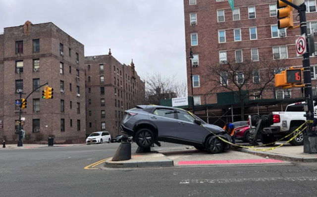 Another view which I shamelessly rubbernecked showing the dramatic inexplicable angle where the car came to rest, presumably after taking an illegal u-turn too fast... or maybe they were swerving to avoid hitting someone. That would be more respectable. 

Big brick buildings of the Bronx loom.