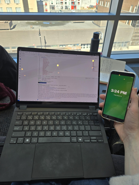 My laptop and Linux phone (Google Pixel 3a) in a library