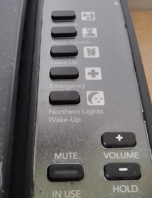 A phone with a button marked "Northern Lights Wake-Up"