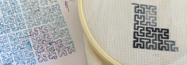 More progress on Hilbert curve crossstitch with some of my notes in the background