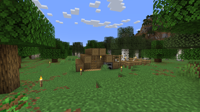 Minecraft screenshot showing a small log cabin built in the shape of a triangle. To the right of the cabin is a fenced in area with a tree and some chickens.
