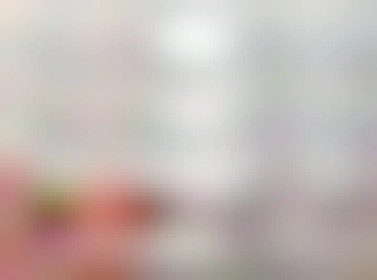 A picture of a hand holding an insulated screwdriver and turning a screw on a wall plug. The hand is grasping the shaft of the screwdriver and not at all paying attention to how many fingers and thumbs it has touching the non-insulated part of the tool.