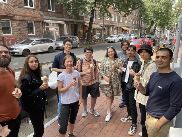 Tuta Team smiling while enjoying ice creams. 