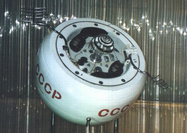 Nasa photo of a Soviet space probe, public domain. Looks like a white donut with a couple strange antennas and CCCP painted on the side.