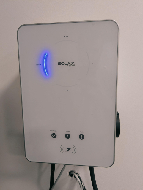 A photo of Solax wall box charging in the green mode.