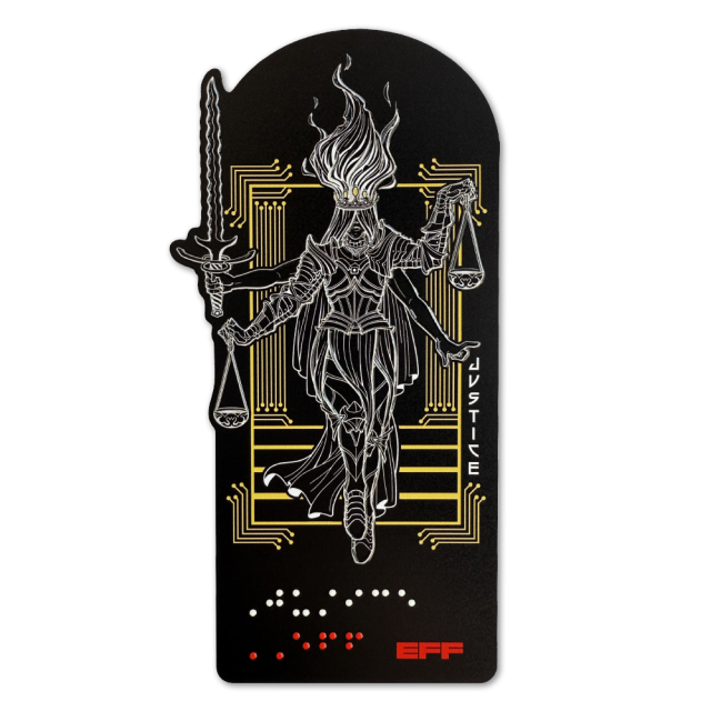 Tactile graphic sticker depicts figure of Lady Justice with fiery hair and flowing garment below armor, holding a sword and scales, with braille reading ‘Justice’ in white, and ‘EFF’ in red. The figure’s body, legs, arms, hair, and objects are raised, showing the outlines tactually so you can show off and feel the design.