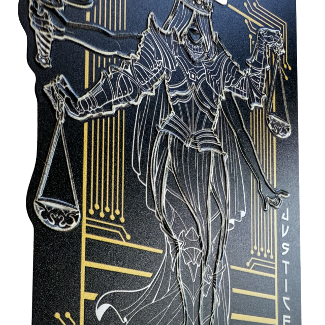 Tactile graphic sticker depicts figure of Lady Justice with fiery hair and flowing garment below armor, holding a sword and scales, with braille reading ‘Justice’ in white, and ‘EFF’ in red. The figure’s body, legs, arms, hair, and objects are raised, showing the outlines tactually so you can show off and feel the design.