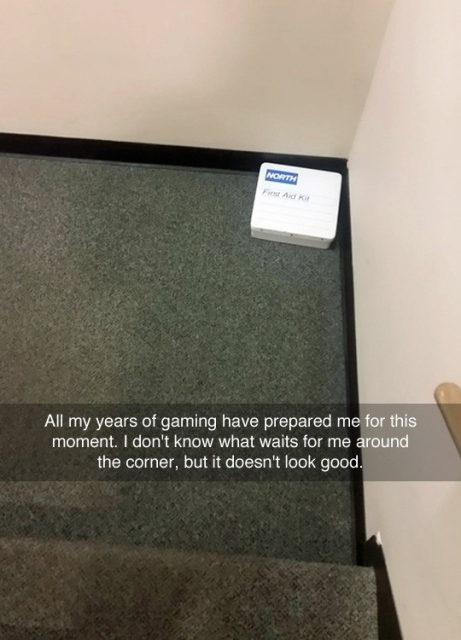 Photo of a first aid kit lying on the floor in corner of some stairs at an office. Snapchat style caption says:
All my years of gaming have prepared me for this moment. I don't know what waits for me around the corner, but it doesn't look good.