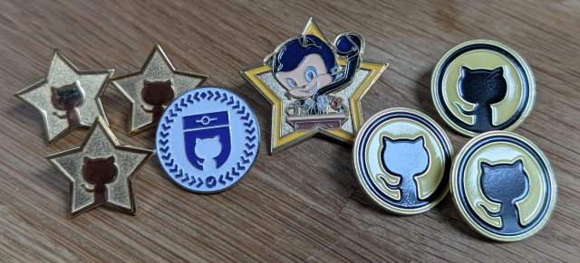 Eight GitHub pins of four different kinds. 
