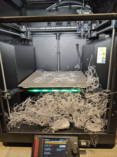 Plastic spaghetti inside a 3D printer