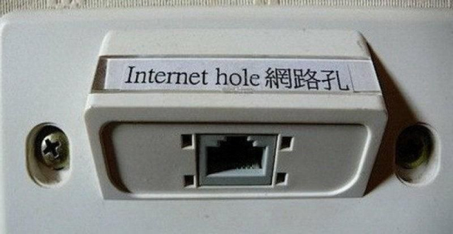 Photo of an ethernet port with and English and Chinese label that says: Internet hole 網路孔