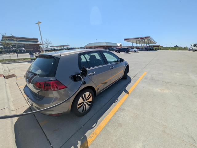 A Volkswagen golf charging at a service station