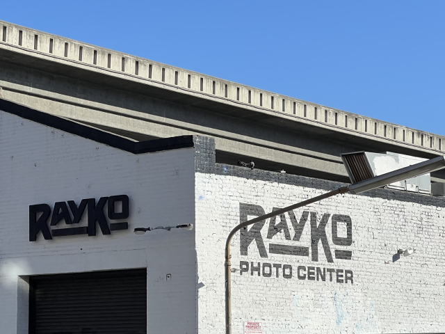 RAYKO
PHOTO CENTER 

Sharp angles, fancy text