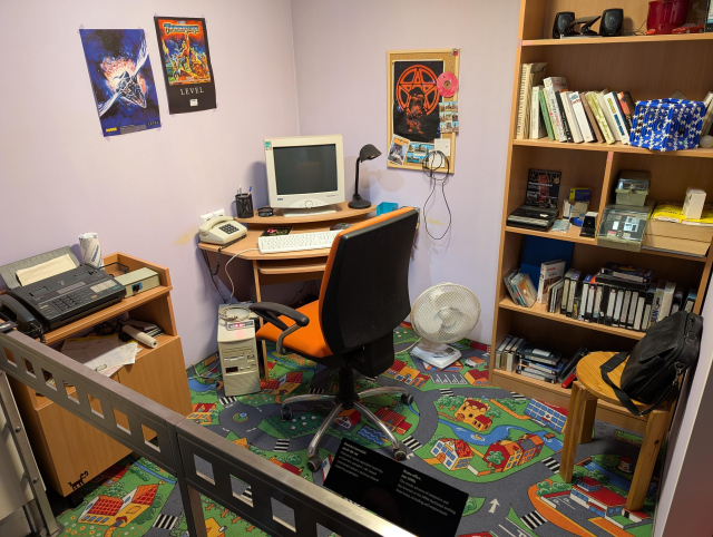 Typical 1990s bedroom. CRT monitor, modem, vhs and floppy disks.