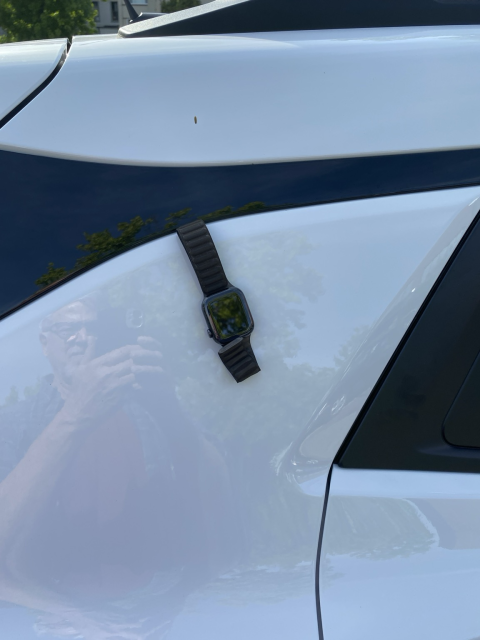 My watch, magnetically stuck on the side of my car. 