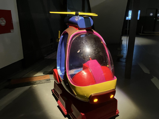 Tiny red helicopter for kids to play in.