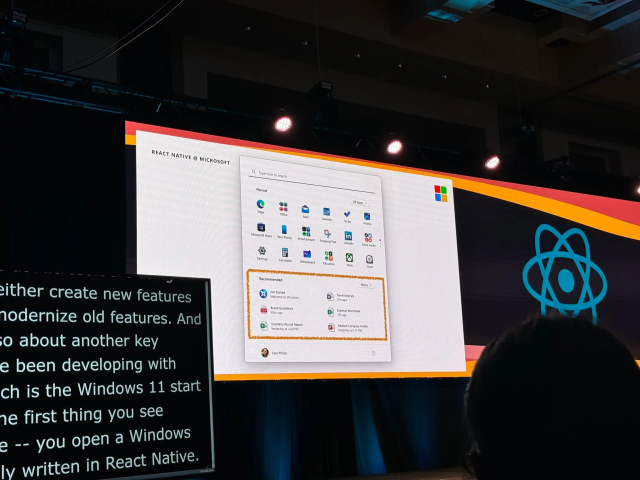 photo at some react native conference idk  where a windows 11 screenshot with a box drawn around the start menu Recommended section is being presented 