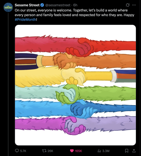 A post by the X account of Sesame Street: "On our street, everyone is welcome. Together, let’s build a world where every person and family feels loved and respected for who they are. Happy PrideMonth!" Below this is a picture of the arms of the characters holding hands, creating a rainbow.