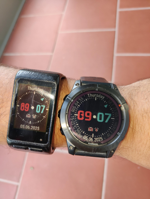 Two garmin watches. Older shows the previous version of the watchface, newer shows the newly ported watchface.

The new watchface has now text above and below the dial rendered radially to fully utilize the round display.