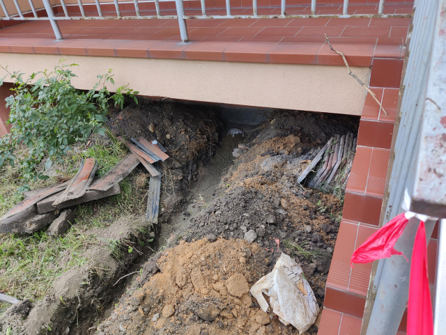 A trench leading to the house