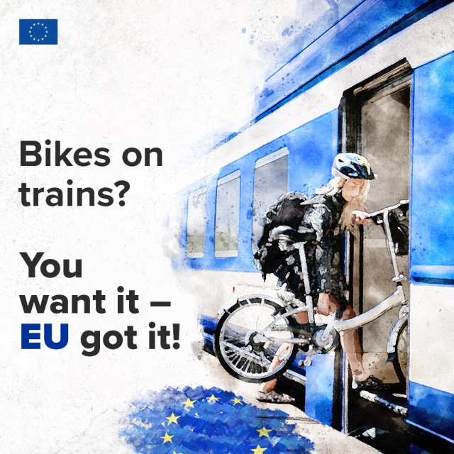 Illustration of a woman with a helmet carrying a bicycle while boarding a blue and white train. The text reads: ‘Bikes on trains? You want it – EU got it!’ An EU flag is shown on the ground and in the top-left corner. 