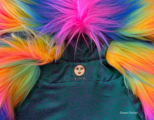 Photo of back neck lining with embroidered face. 