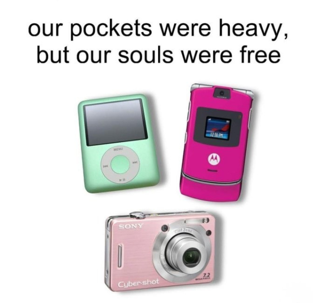 A nostalgic meme featuring three iconic 2000s gadgets arranged on a white background. At the top, bold black text reads “Our pockets were heavy, but our souls were free.” Below are a mint green iPod nano with its characteristic click wheel and small rectangular screen, a hot pink Motorola Razr flip phone displaying “12:34 AM” on its external screen, and a pink Sony Cyber-shot digital camera with a protruding lens. The devices are positioned in a triangular arrangement, evoking the era when carrying multiple gadgets was the norm before smartphones consolidated everything into one device.