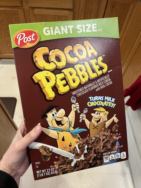Box of Cocoa Pebbles cereal featuring Fred Flintstone and Barney Rubble