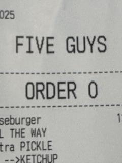 A receipt for order zero at five guys.