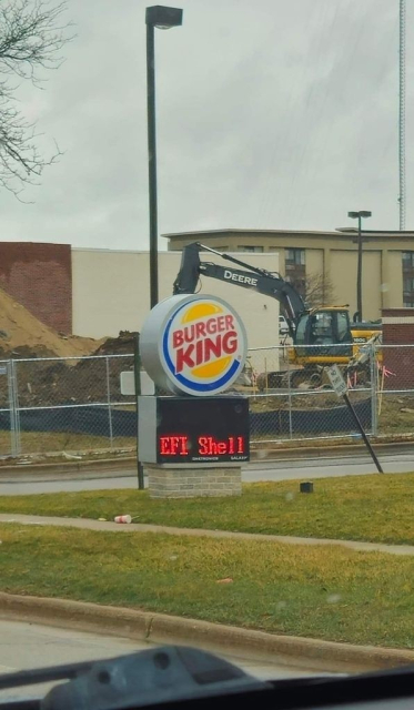 Photo of a Burger King sign banner that just says, "EFI Shell"