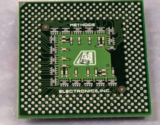 The top of a PGA370 package, with only some resistors and caps on it