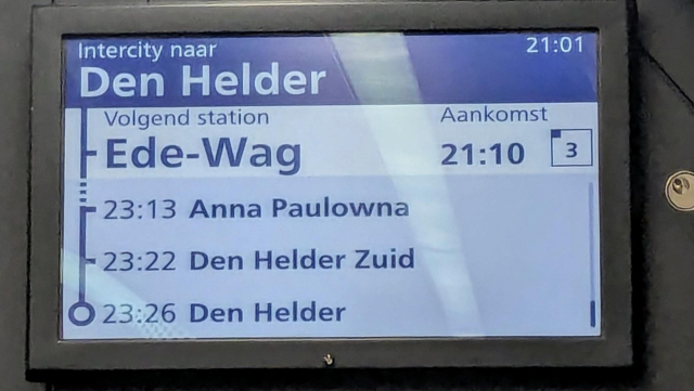 A picture of an onboard information screen on a train. The next station is displayed as Ede-Wag
