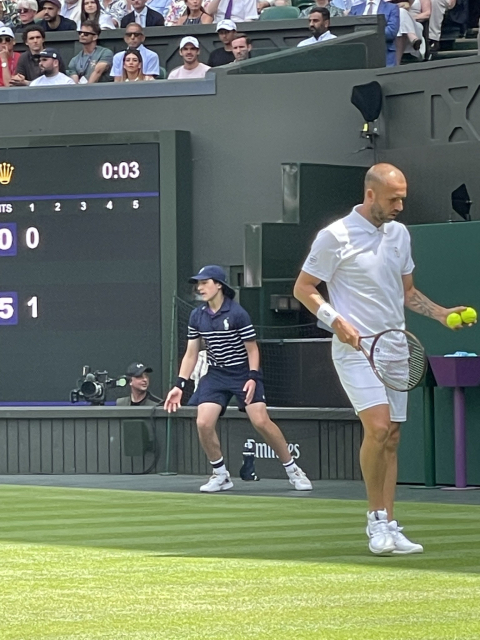Our view of Dan Evans about to serve. We're ridiculously close.
