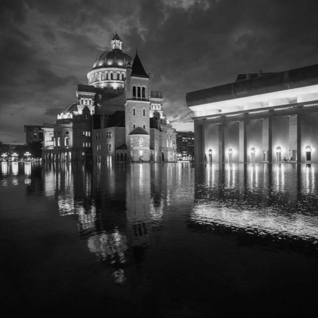 The First Church of Christ, Scientist, just after sunset.  The reflecting pool is the bottom half of the photo, and there's some wind, so the church is crisply skewed to the right in the reflection of the waves.
