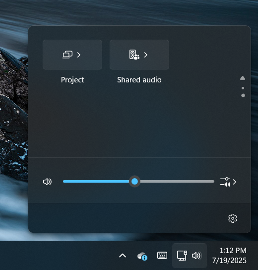 Quick settings menu in Windows 11. A "Shared audio" quick setting is visible at the top.