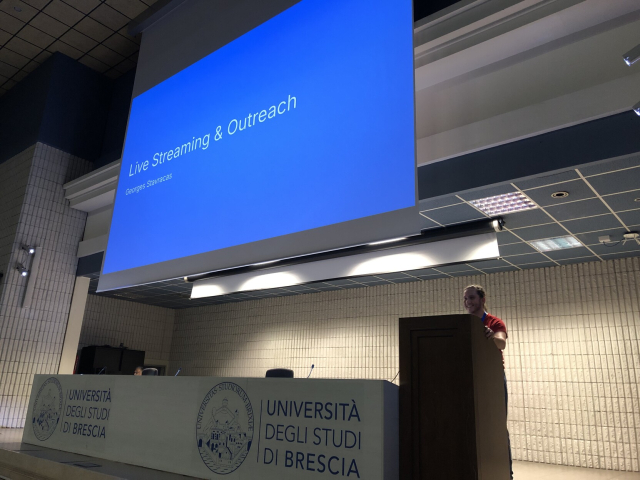 Georges giving his talk at the podium.