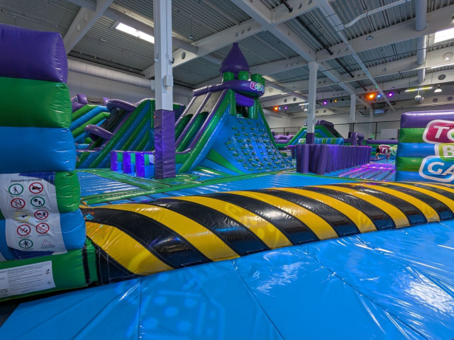 A large room with inflated attractions for jumping.